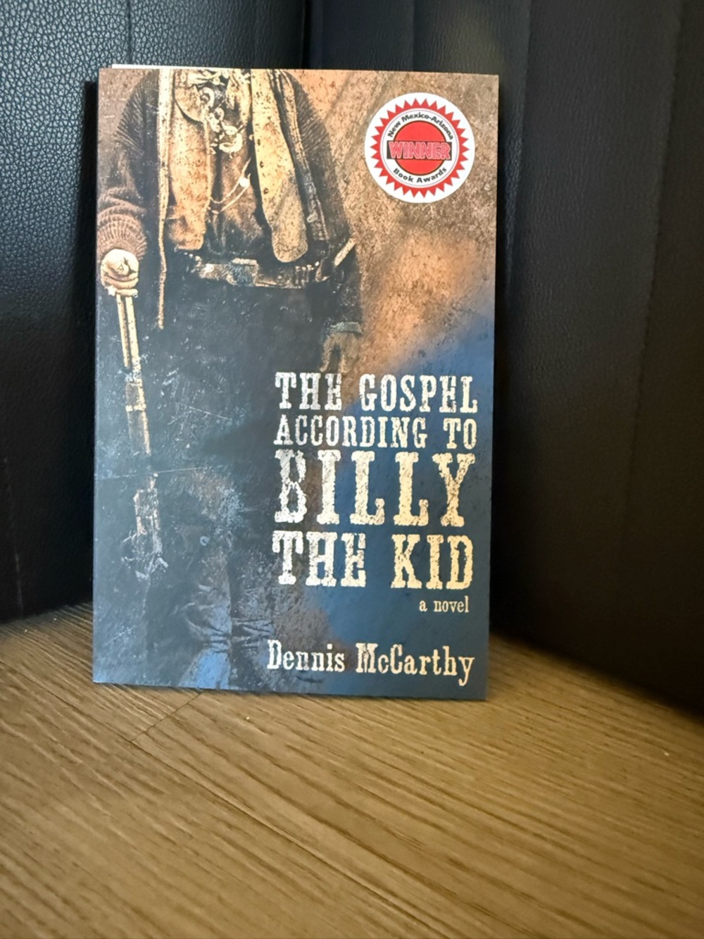 The Gospel According to Billy the Kid by Dennis McCarthy - Brown & Black Cover